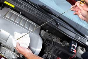 Vehicle Fluid Inspection - Cottman Man - Cottman Transmission and Total Auto Care